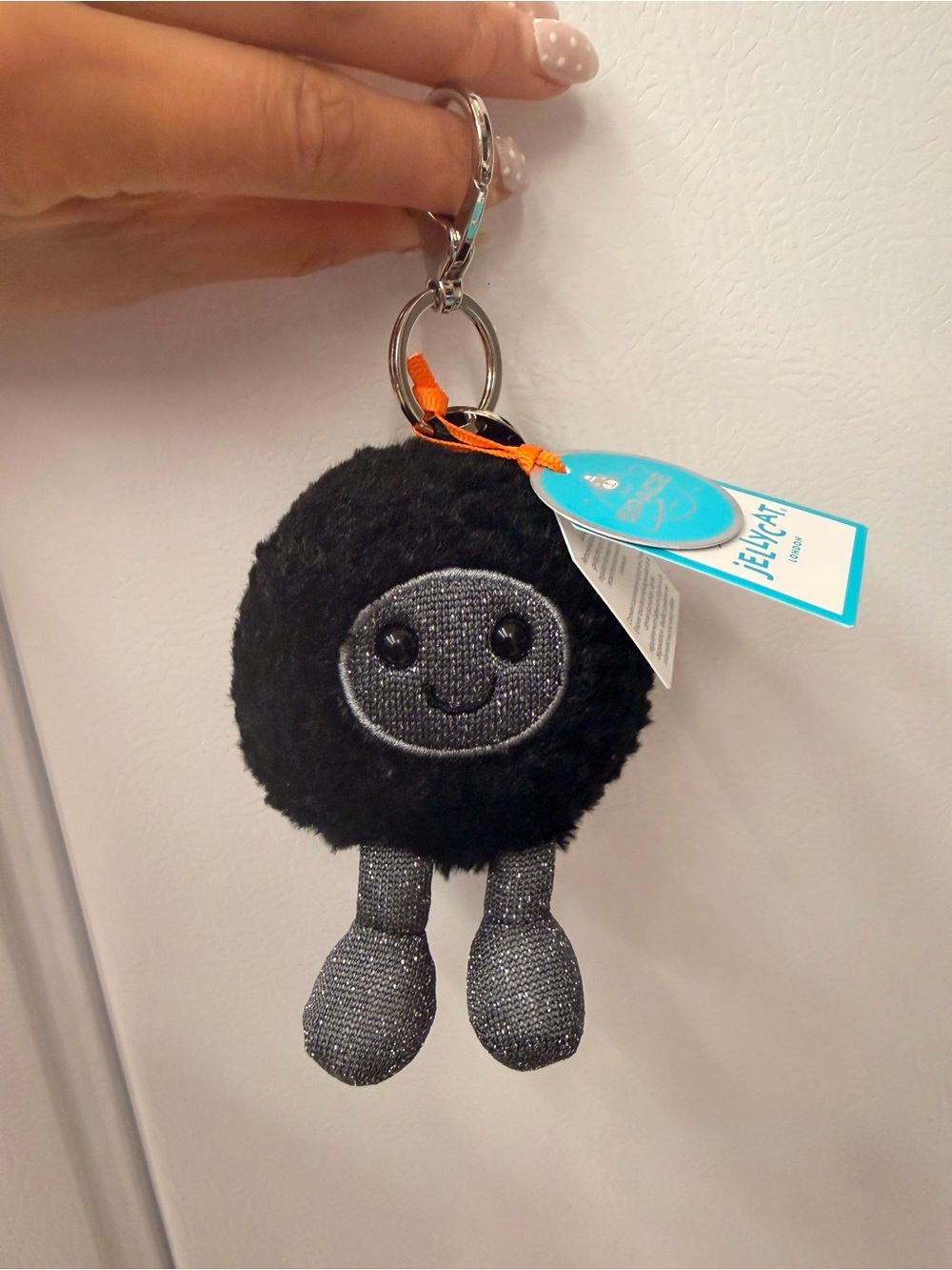 Jellycat amuseables black hole bag charm space collection